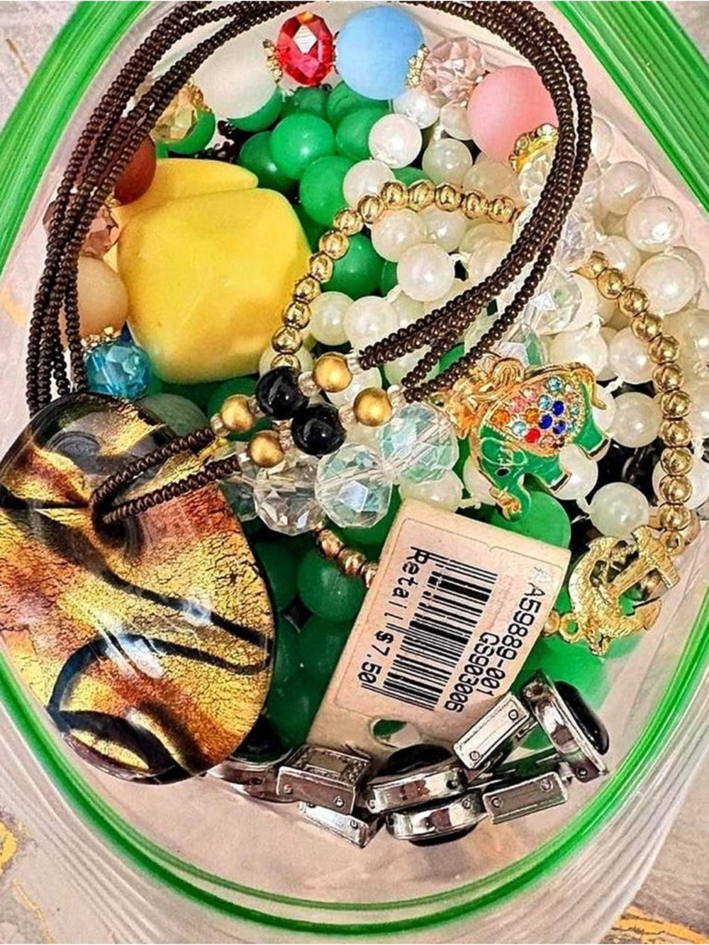 Lot of vintage Jewelry bundle with beaded necklaces, bracelets, and charms